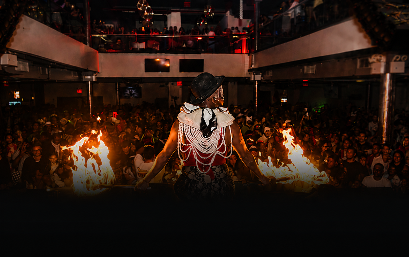 Fire performer above the crowd at The Haunted Festival in New York City